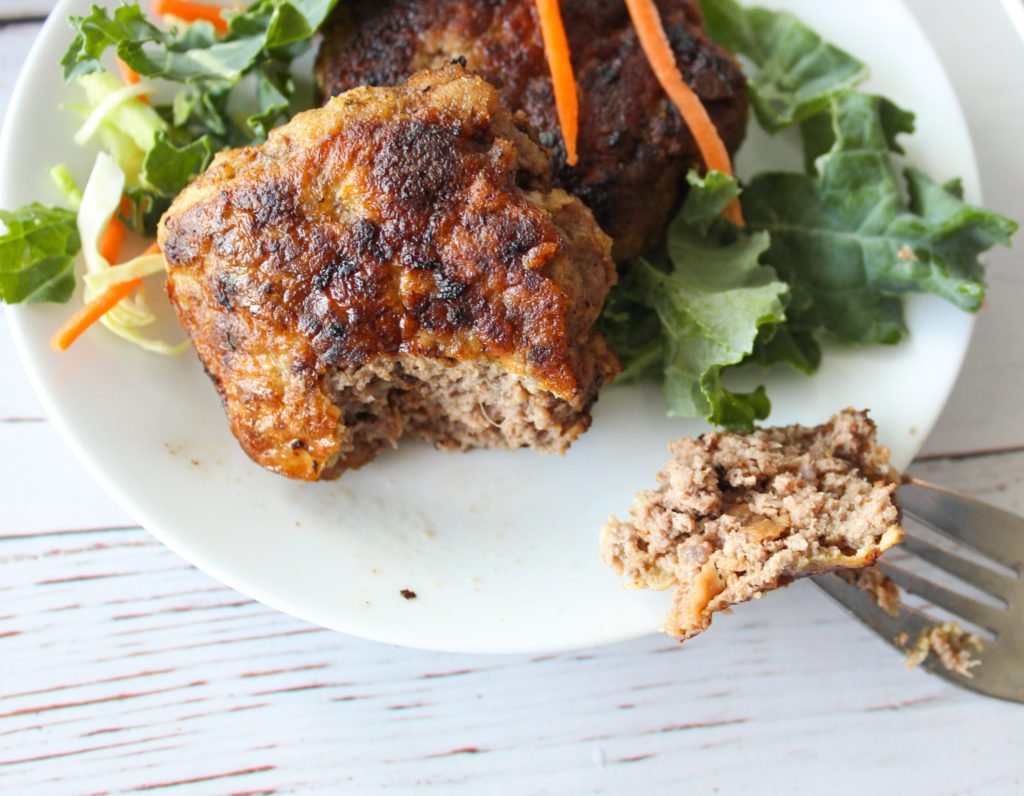 ground beef cutlets with a bite on a fork 