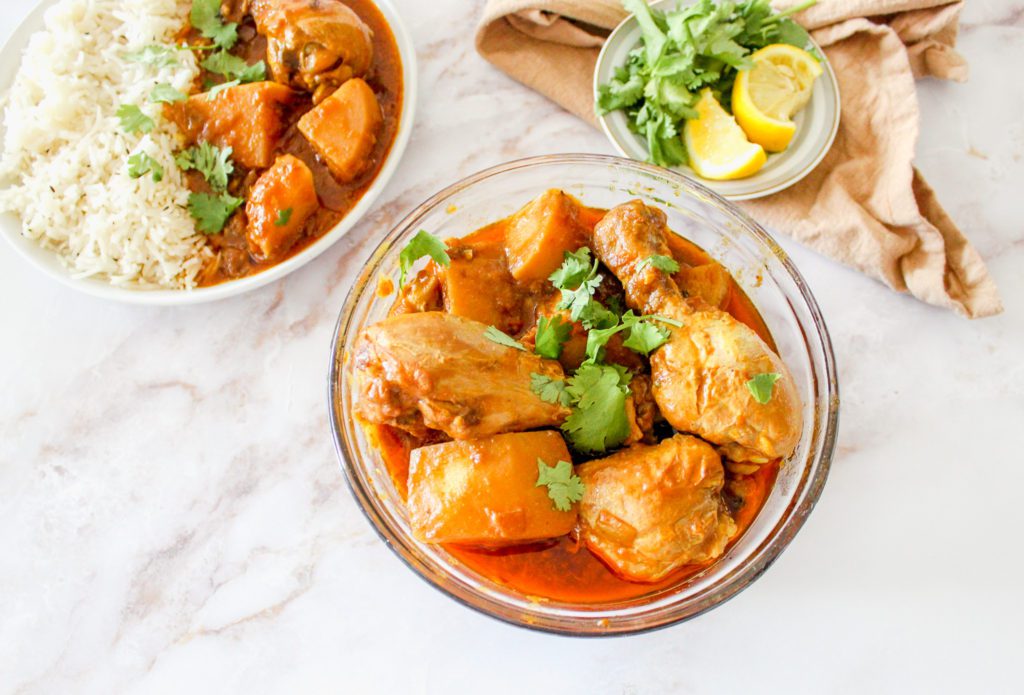 Pakistani Chicken Curry Recipe in a bowl garnished with cilantro