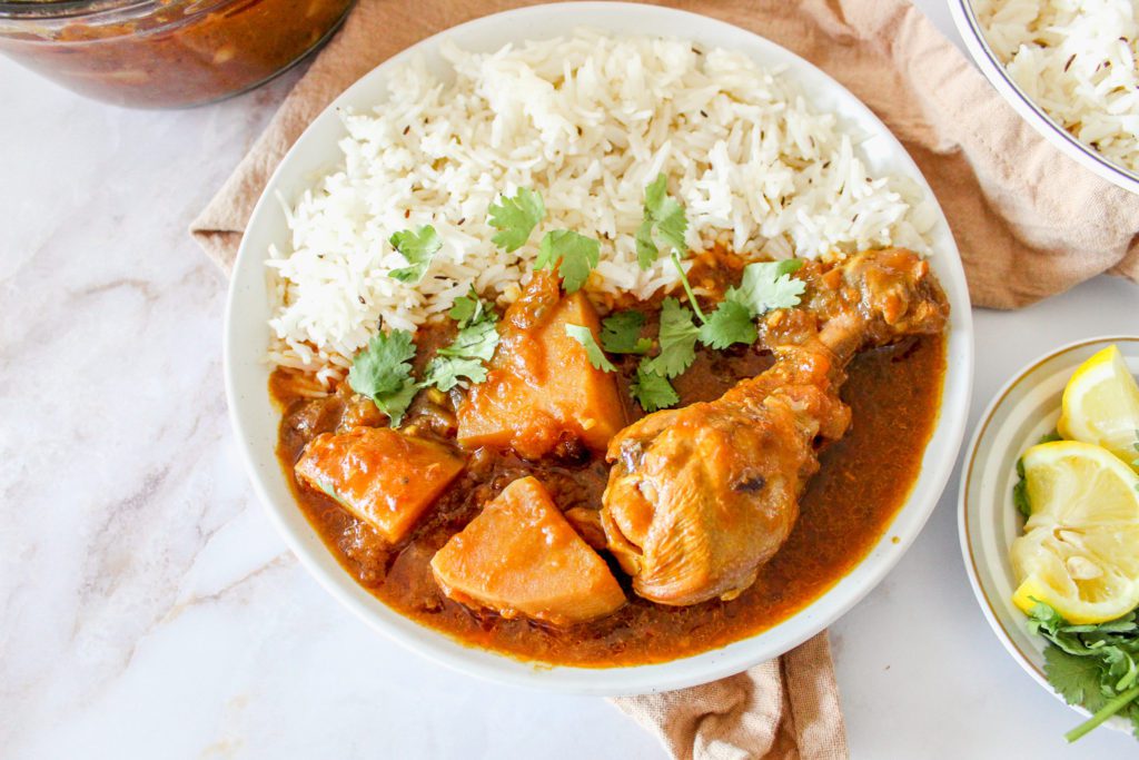 Pakistani Chicken Curry Recipe finished product on a plate with rice