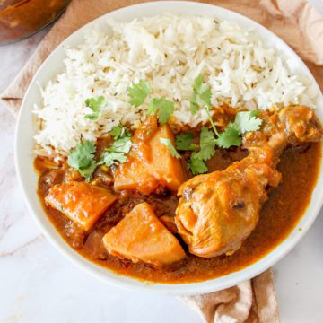 Pakistani Chicken Curry Recipe served on a plate garnished with cilantro