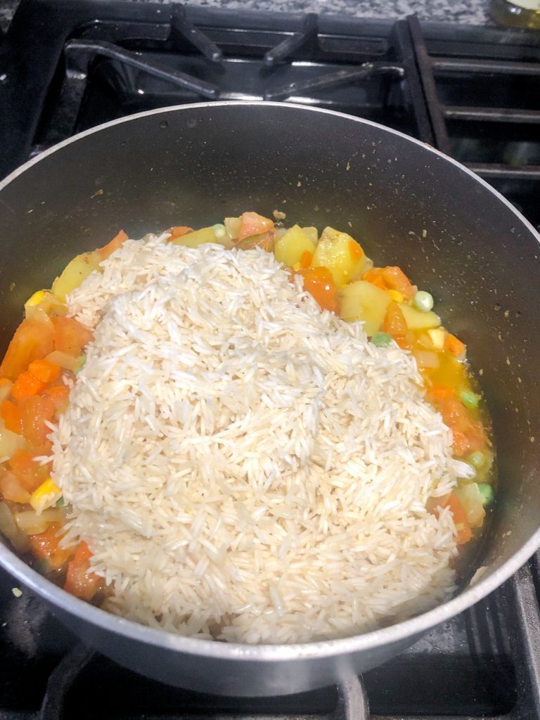 vegetable pulao ingredients cooking in pot