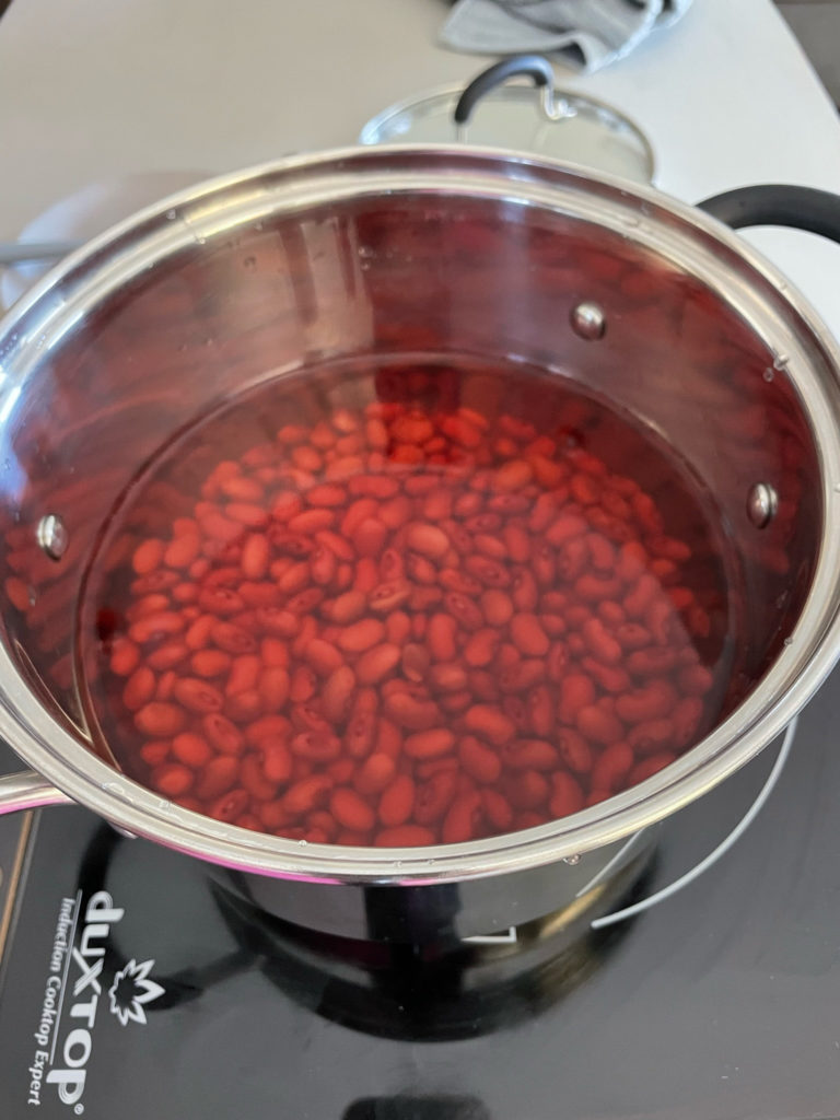 water and dried red kidney beans to a pot for rajma chawal