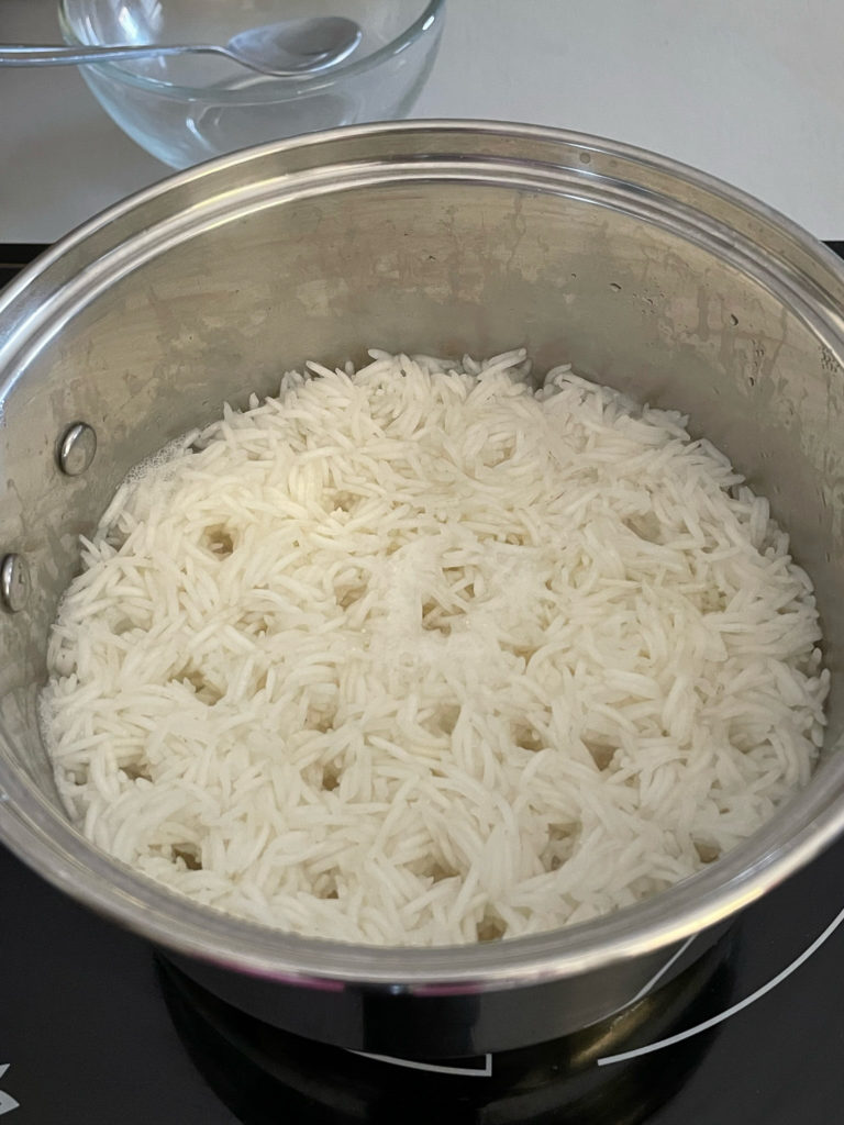 rice cooked in a pot for rajma chawal
