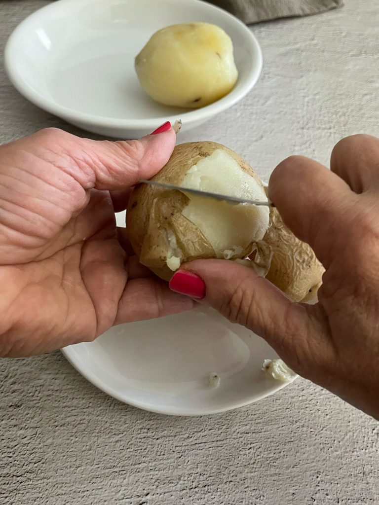 potato peeled by hand